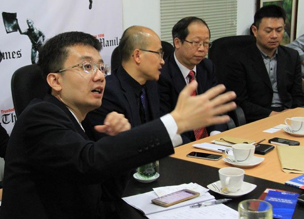 NEW SILK ROAD Chinese scholars discuss Beijing’s intiative to link Asia, Africa and Europe in a trade and infrastructure network reminiscent of the old Silk Road. From left: Song Qingrun, assistant professor at the China Institutes of Contemporary Internal Relations; Zhang Zhenjiang, dean of the Academy of Overseas Chinese Studies; Liu Zhijie, counselor, Department of Asian Affairs, Chinese Ministry of Foreign Affairs; and Ethan Sun, counselor at the Chinese embassy. PHOTO BY ROGER RAÑADA 