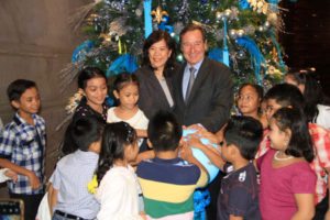 Marco Polo Ortigas Manila General Manager Frank Reichenbach with XTT President Lily Pedrosa light up the 26feet tall Christmas tree with the kids of River Springs School 