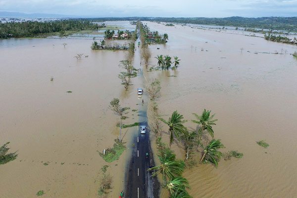 Albay Flooded Aerial photo shows a flooded highway after typhoon ‘Nina’ made landfall in Polangui, Albay province on December 26. Nina, which made landfall on the eastern island province of catanduanes on December 25, caused the deaths of at least seven people, displaced more than 380,000, and grounded more than 300 flights. AFP Photo