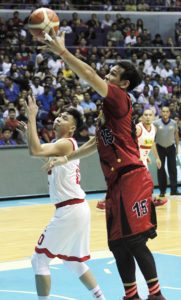 San Miguel Beer’s June Mar Fajardo soars over Ian Sangalang of Star Hotshots during a PBA Philippine Cup game at the Araneta Coliseum.   PHOTO BY BOB DUNGO JR.