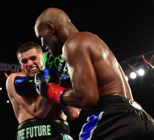 Joe Smith Jr. takes a punch from Bernard Hopkins as Smith goes on to win the WBC International Light Heavyweight title in a ninth round TKO at The Forum on Sunday in Inglewood, California.  AFP PHOTO 