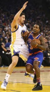 Brandon Jennings No.3 of the New York Knicks drives on Klay Thompson No.11 of the Golden State Warriors at ORACLE Arena on Friday in Oakland, California.  AFP PHOTO 