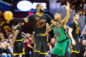 LeBron James No.23 of the Cleveland Cavaliers looks for a pass while under pressure from Marcus Smart No.36 of the Boston Celtics during the second half at Quicken Loans Arena on Friday in Cleveland, Ohio.  AFP PHOTO