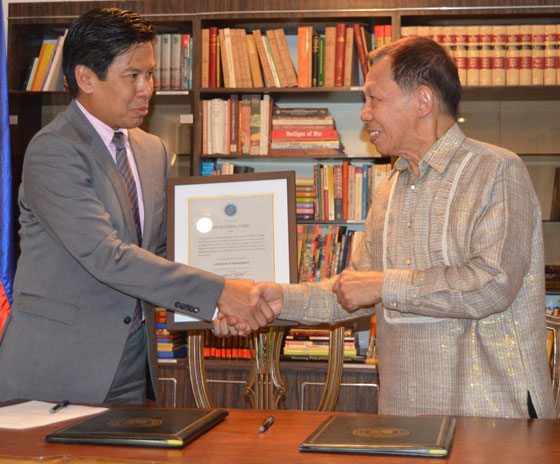 Philippine Ambassador to Egypt Leslie Baja (left) receives a Certificate of Establishment of the Sentro Rizal in Cairo from NCCA Chairman Felipe de Leon 