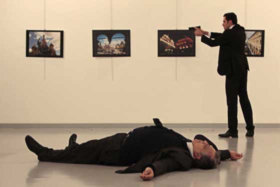 BRAZEN Photo shows Andrey Karlov, the Russian ambassador to Ankara, lying on the floor after being shot by Mevlut Mert Altintas (right) during a public event in Ankara. Altintas cried ‘Allahu Akbar’ and ‘Don’t forget Aleppo’ and shot Karlov while he was visiting an exhibition. The state-run Anadolu news agency said the gunman had been ‘neutralized.’ AFP PHOTO