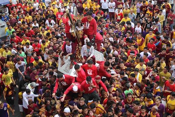 EARLY STARTDevotees join a thanksgiving procession on Saturday ahead of the Black Nazarene feast on January 19 which is expected to draw millions. PHOTO BY RUSSELL PALMA