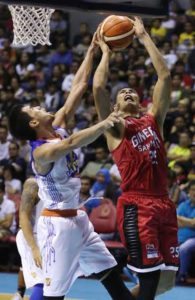 Talk ‘N Text Troy Rosario (left) blocks Ginebra’s Japeth Aguilar during the Philippine Basketball Association Season 42 Philippine Cup elimination round. RUSSELL PALMA