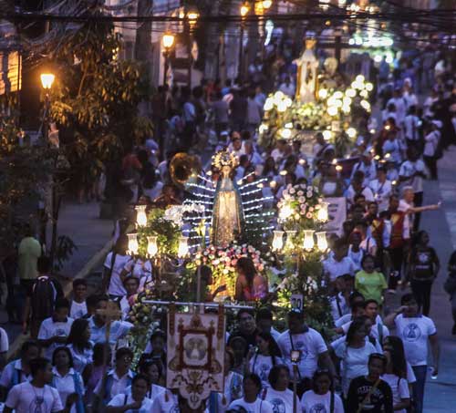 Thousands of Marian devotees join the annual procession of Marian images in Intramuros, Manila on Sunday. The Catholic Church observes the feast of the Immaculate Conception on December 8. PHOTO BY DJ DIOSINA