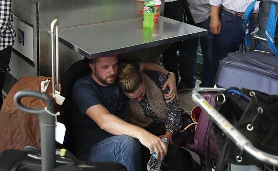 LONE WOLF People wait at the Fort Lauderdale-Hollywood International airport after a shooting near the baggage claim in Fort Lauderdale, Florida. Officials said five people were killed and eight wounded in an attack by a single gunman. AFP PHOTO