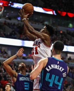 Jimmy Butler No.21 of the Chicago Bulls puts up a shot between Jeremy Lamb #3 and Frank Kaminsky 3rd No.44 of the Charlotte Hornets at the United Center on Tuesday in Chicago, Illinois.  AFP PHOTO 