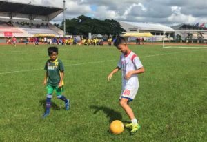 Little Azkals standout Agiel Rojo of South Cotabato (right) mentors a young booter from Davao del Norte during a Football For A Better Life leg in Tagum City.  CONTRIBUTED PHOTO