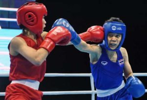 Josie Gabuco (left) of the Philippines fights against Thailand’s Chuthamat Raksa in their women’s light flyweight (45kg-48kg) boxing final at the 28th Southeast Asian Games (SEA Games) in Singapore. AFP PHOTO