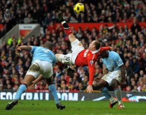 Manchester United’s English striker Wayne Rooney (center) scoring their second goal during the English Premier League football match between Manchester United and Manchester City at Old Trafford in Manchester, north-west England.  AFP FILE PHOTO