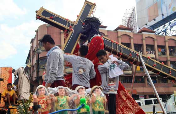 DAY OF DEVOTION The Black Nazarene will take center stage during the slow and long procession around Manila today that is expected to draw at least 15 million devotees. PHOTO BY BOB DUNGO JR.