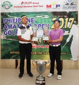 Thai Sadom Kaewkanjana (left) and Filipino-Japanese Yuka Saso hold their huge trophies after dominating their respective divisions in the 2017 Philippine Amateur Golf Championship.  CONTRIBUTED PHOTO