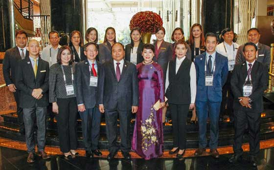 (Front row, from left) Diamond Hotel Philippines (DHP) Food and Beverage Director Louie Ramos, DHP Sales and Marketing Director Sunshine Robles, DHP Chief Financial Officer Winada Effendi, Vietnam Prime Minister Nguyễn Xuân Phúc and wife Tran Nguyet Thu, DHP General Manager Vanessa Ledesma Suatengco, DHP Rooms Division Manager George Reynoso, and DHP Security Manager Philbert Togle joined by other hotel managers (back row)