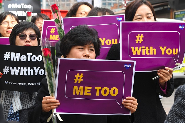 South Korean demonstrators hold banners during  a rally on International Women's Day 