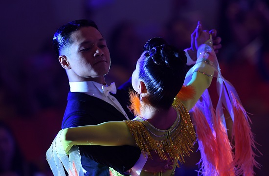 Philippines Sean Mischa Aranar (L) and Ana Leonila Nualla (R) perform during the dancesport event in the SEA Games (Southeast Asian Games) in Clark, Capas town, Tarlac province north of Manila on December 1, 2019. (Photo by WAKIL KOHSAR / AFP)